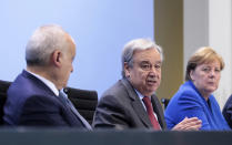 From left, U.N. Envoy for Libya, Ghassan Salame, United Nations Secretary-General Antonio Guterres and German Chancellor Angela Merkel attend a news conference after the conference on Libya at the chancellery in Berlin, Germany, Sunday, Jan. 19, 2020. (Axel Schmidt/Pool Photo via AP)