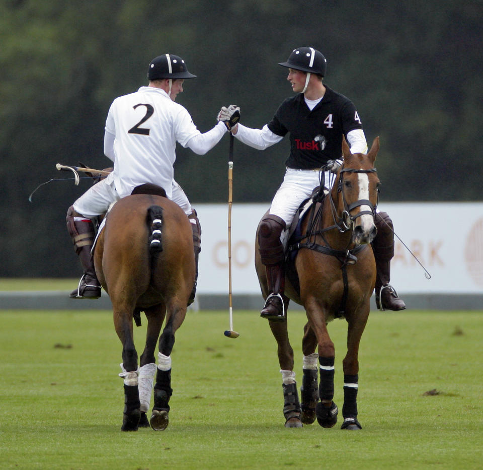 Prince Harry and Prince William, Duke of Cambridge shake hands after competing against each other in the Sentebale Polo Cup polo match at Coworth Park Polo Club on June 12, 2011 in Ascot, United Kingdom.