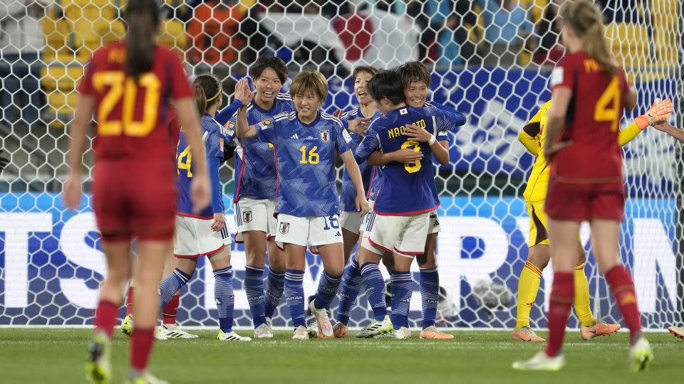 Japan players celebrate at the end of the team's dominant group stage victory over Spain at the Women's World Cup. - John Cowpland/AP
