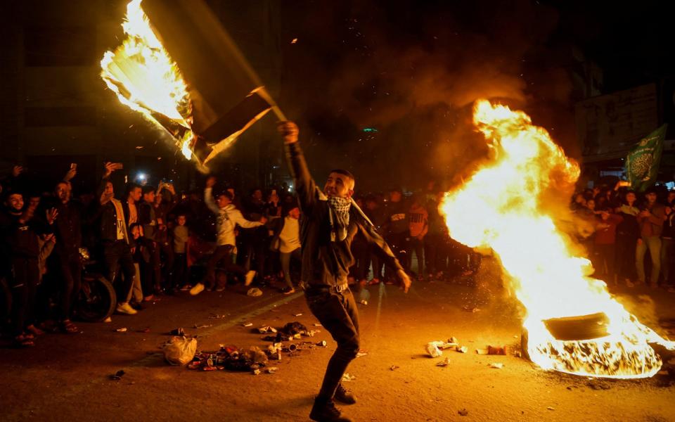 Palestinians celebrate following Jerusalem's shooting attack, in Gaza City Jan 27, 2023 - MOHAMMED SALEM