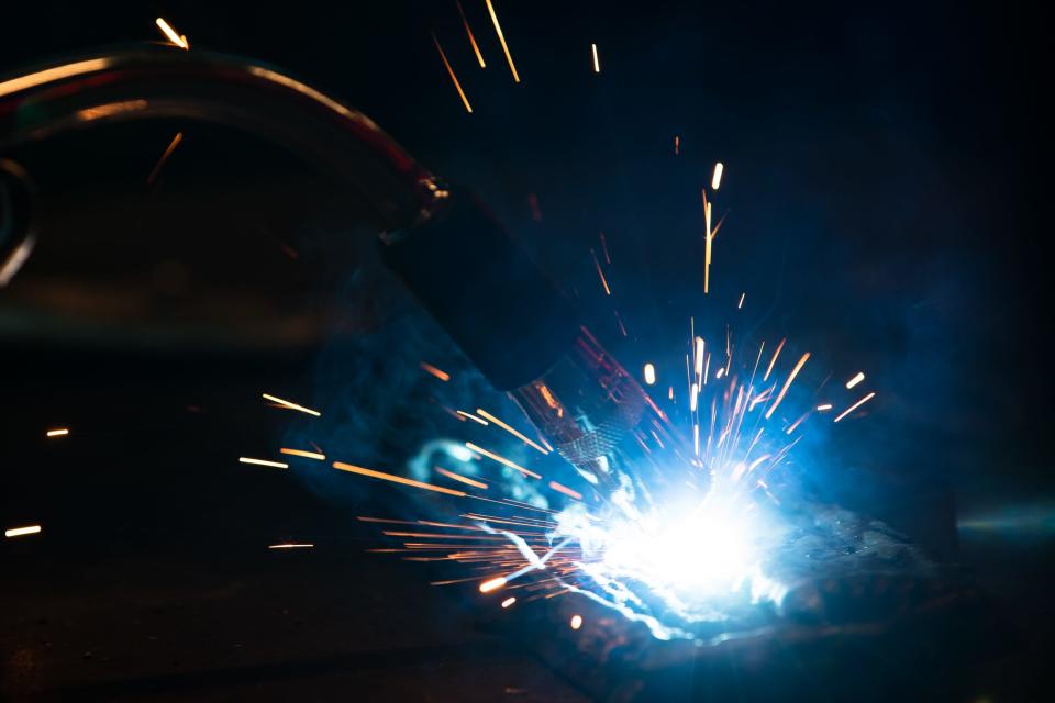 Sparks fly from a welding tool at the Del Mar College's Windward Campus shop on Wednesday, Nov. 17, 2022, in Corpus Christi, Texas.