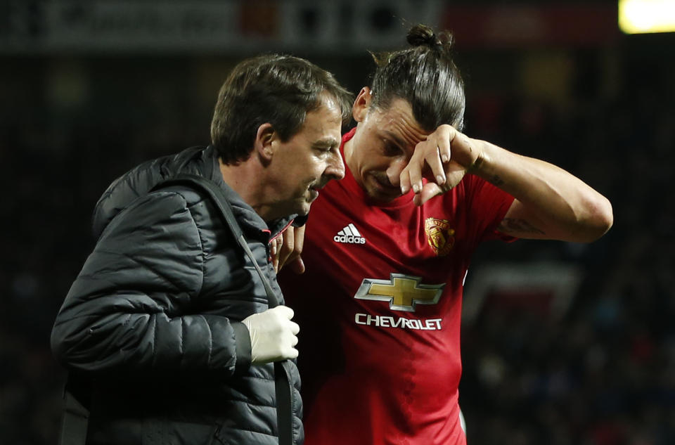 Manchester United's Zlatan Ibrahimovic receives medical attention