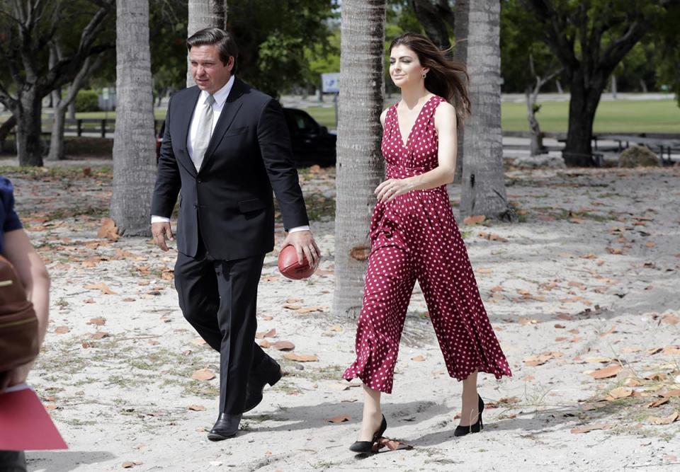 DeSantis walks with his wife Casey following a news conference, April 22, 2019, in Key Biscayne, Fla.