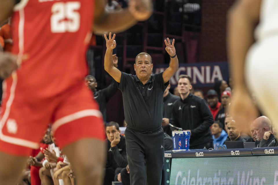 Houston head coach Kelvin Sampson directs his team during the first half of an NCAA college basketball game against Virginia in Charlottesville, Va., Saturday, Dec. 17, 2022. (AP Photo/Erin Edgerton)