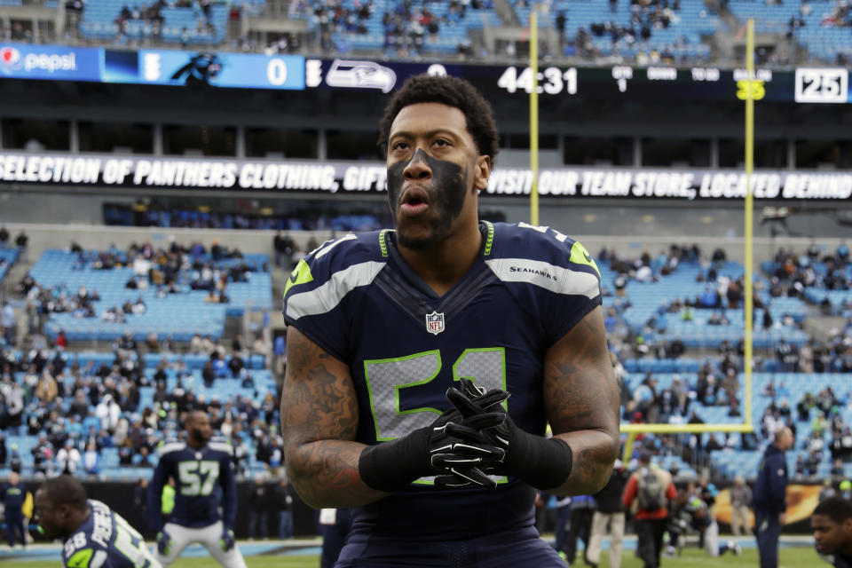 FILE - In this Jan. 17, 2016, file photo, Seattle Seahawks outside linebacker Bruce Irvin (51) warms up before the first half of an NFL divisional playoff football game between the Carolina Panthers and the Seattle Seahawks, in Charlotte, N.C. Irvin is thrilled to be back where his NFL journey started. Irvin jumped at the chance to return to Seattle this offseason, but his reunion with the Seahawks comes with the expectation he can help a lackluster pass rush. (AP Photo/Bob Leverone, File)