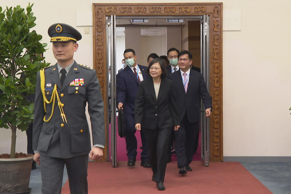 In this image made from video, Taiwan's President Tsai Ing-wen arrives as she prepares to depart on an overseas trip at Taoyuan International Airport in Taipei, Taiwan, Wednesday, March 29, 2023. China has threatened "resolute countermeasures" over a planned meeting between Taiwanese President Tsai Ing-wen and Speaker of the United States House Speaker Kevin McCarthy during an upcoming visit in Los Angeles by the head of the self-governing island democracy. (AP Photo/Johnson Lai)