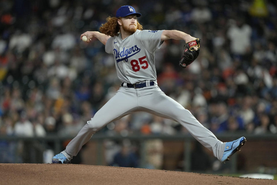 Los Angeles Dodgers pitcher Dustin May throws to a San Francisco Giants batter during the first inning of a baseball game Friday, Sept. 16, 2022, in San Francisco. (AP Photo/Tony Avelar)