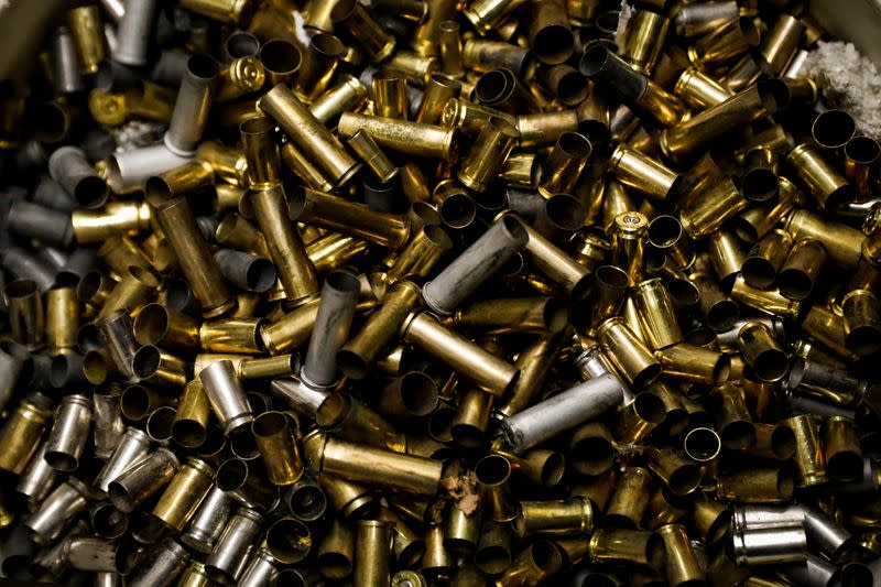 Discarded bullet shell cases are seen at Master Class Shooting Range in Monroe, New York