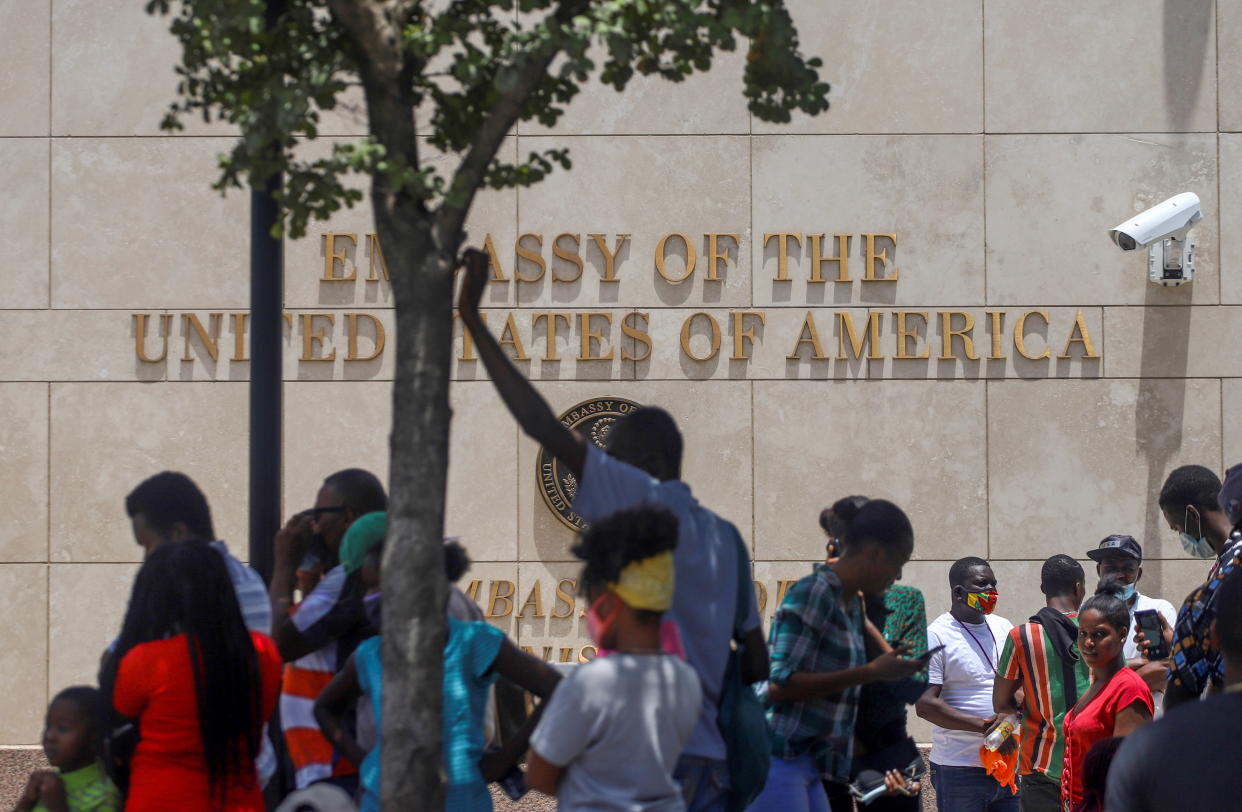 Haitians gather outside the U.S. Embassy after the assassination of President Jovenel Moïse, in Port-au-Prince, Haiti, on July 9.