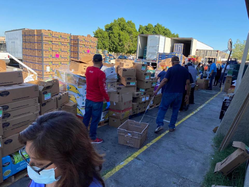 Workers unload food at Gethsemani Baptist Church in San Luis in spring of 2020.