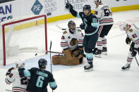 Seattle Kraken center Mason Appleton (22) reacts after Kraken defenseman Vince Dunn (not shown) scored a goal against Chicago Blackhawks goaltender Marc-Andre Fleury (29) during the second period of an NHL hockey game, Monday, Jan. 17, 2022, in Seattle. (AP Photo/Ted S. Warren)