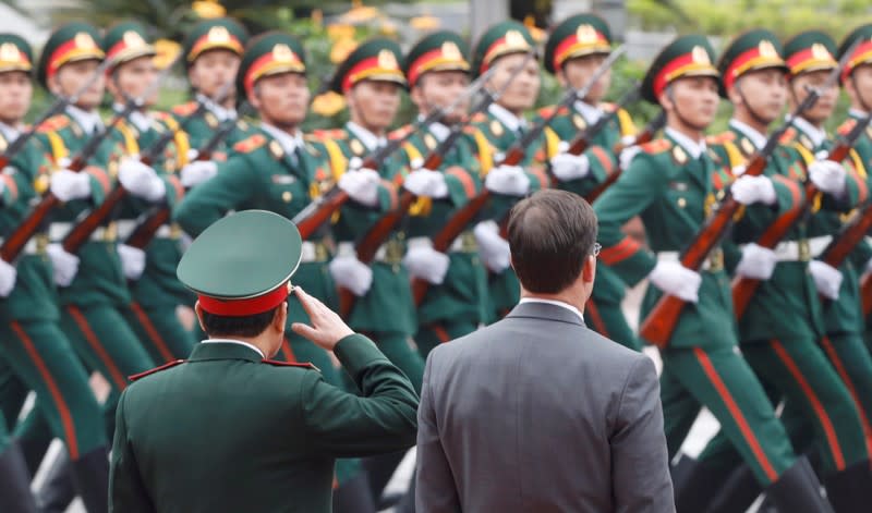 U.S. Defense Secretary Mark Esper and Vietnam's Defence Minister General Ngo Xuan Lich attend a welcoming ceremony in Hanoi