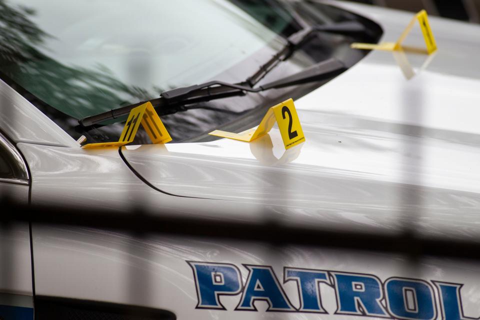 Evidence markers sit on top of a Tallahassee Police Department patrol car after an officer involved shooting occurred in the Holton Street apartments complex on Wednesday, May 27, 2020. The person who was killed by police is believed to have stabbed and killed a man on Saxon Street.