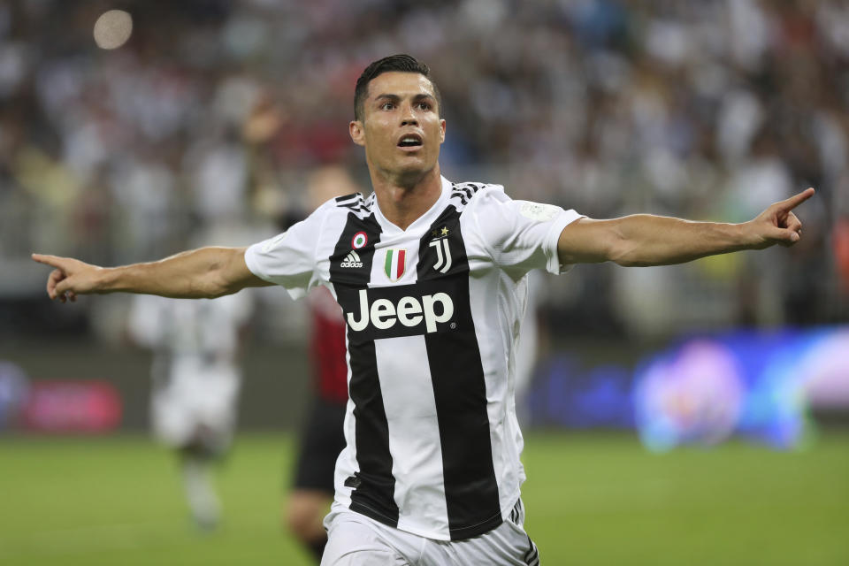 Juventus' Cristiano Ronaldo celebrates after scoring his side's opening goal during the Italian Super Cup final soccer match between AC Milan and Juventus at King Abdullah stadium in Jiddah, Saudi Arabia, Wednesday, Jan. 16, 2019. (AP Photo)