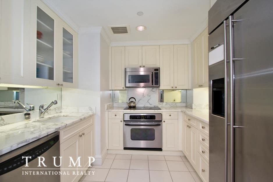 The kitchen has white marble counters and floors. (Photo: <a href="https://streeteasy.com/blog/ivanka-trumps-condo-hits-market/" target="_blank">Photo source: Trump International Realty New York via StreetEasy listing</a>)