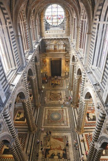 The mosaic floor in the Siena cathedral is pictured in August 2012. Magnificent Renaissance mosaics in the floor have been unveiled to give visitors a rare glimpse of scenes it took local artists 500 years to create