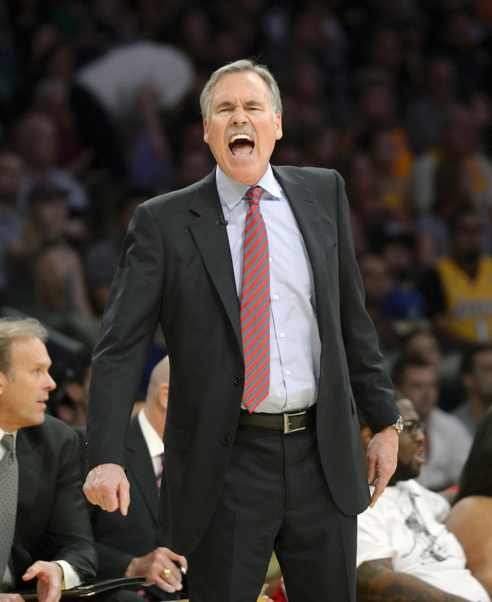 FILE - In this Feb. 21, 2014, file photo, Los Angeles Lakers head coach Mike D'Antoni yells at referees during the second half of an NBA basketball game against the Boston Celtics in Los Angeles. D'Antoni has resigned after less than two seasons on the job. Lakers spokesman John Black confirmed D'Antoni's resignation Wednesday, April 30. (AP Photo/Mark J. Terrill, File)