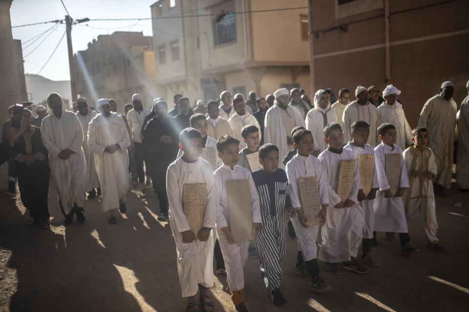 People take part in a rain prayer procession during a drought, in Alnif oasis town, near Tinghir, Morocco, Monday, Nov. 29, 2022. November is usually a cold, wet month, but when the rain failed to come, the king called for rain prayers across the country, an old Islamic tradition during desperately dry times. (AP Photo/Mosa'ab Elshamy)