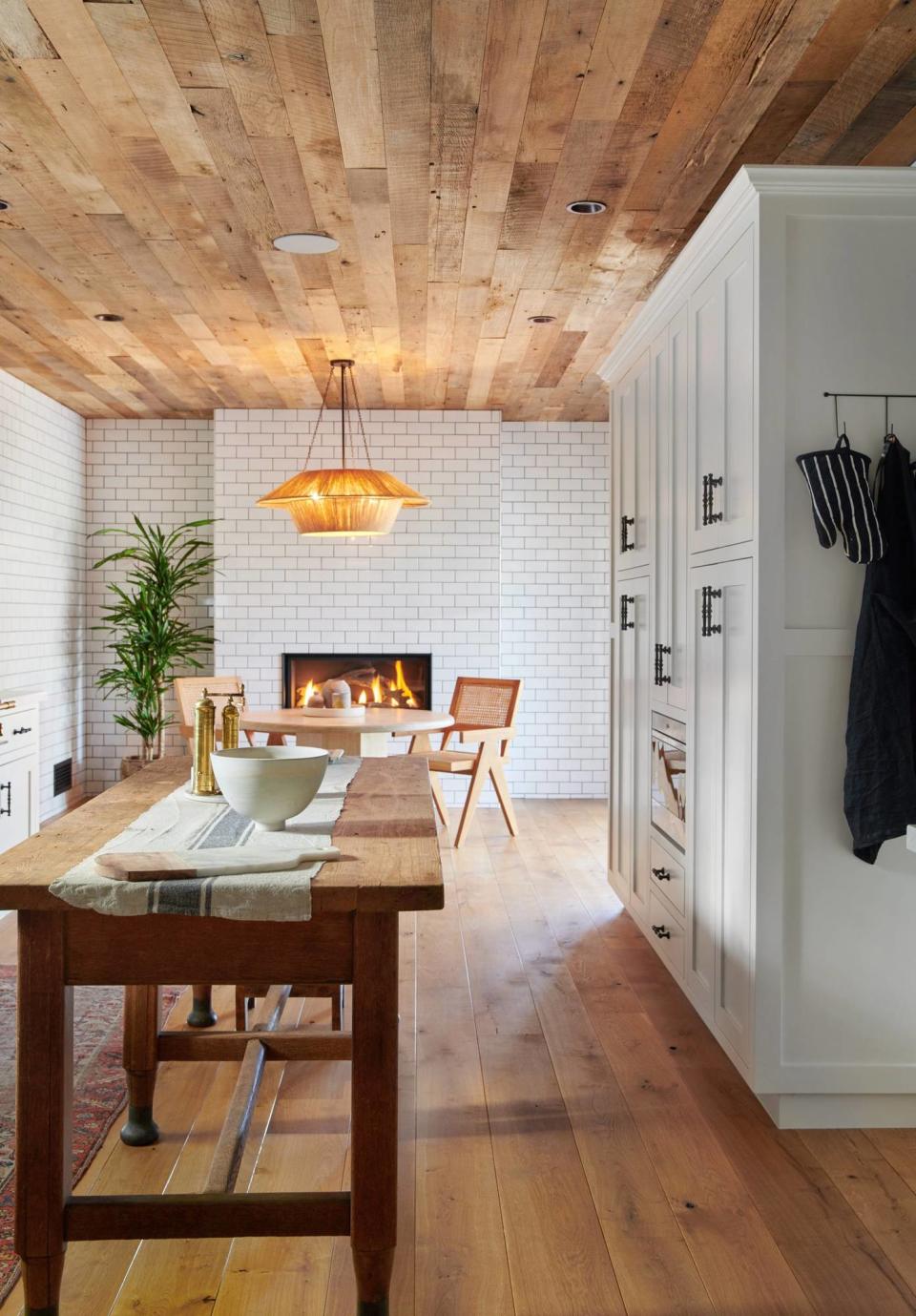 Lovely Los Feliz kitchen and dining renovation from Ashley Tisdale's Frenshe Interiors, complete with a fireplace by Michael Tisdale.