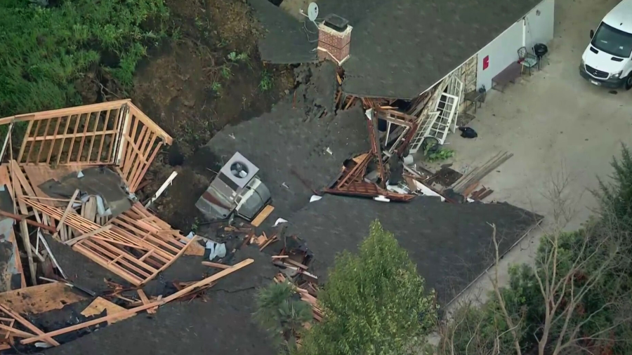 A home is red tagged after a mudslide in Sherman Oaks on March 13, 2024. (KTLA)