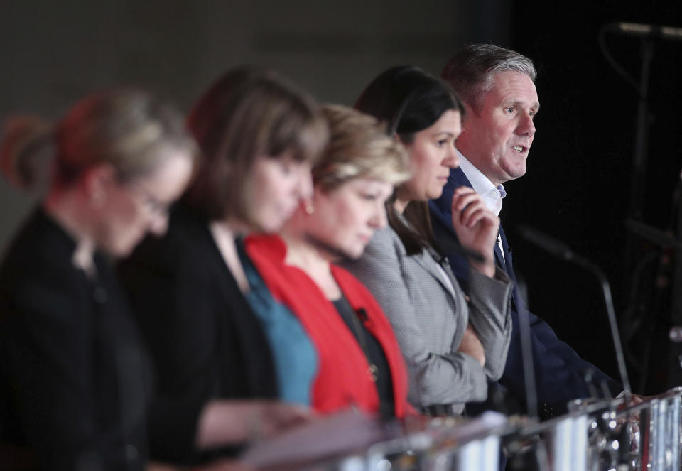 From left, Labour Members of Parliament, Rebecca Long-Bailey, Jess Phillips, Emily Thornberry, Lisa Nandy and Keir Starmer stand on the stage, during the first Labour leadership hustings at the ACC Liverpool, in Liverpool, England, Saturday, Jan. 18, 2020. (Danny Lawson/PA via AP)