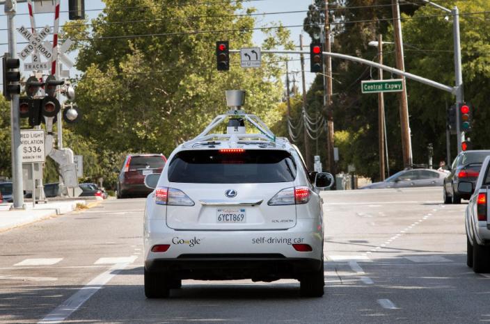 This Wednesday, April 23, 2014 photo provided by Google shows the Google driverless car navigating along a street in Mountain View, Calif. The director of Google's self-driving car project wrote in a blog post Monday, April 28, that development of the technology has entered a new stage: trying to master driving on city streets. Many times more complex than freeways, which the cars can now reliably navigate, city streets represent a huge challenge. (AP Photo/Google)