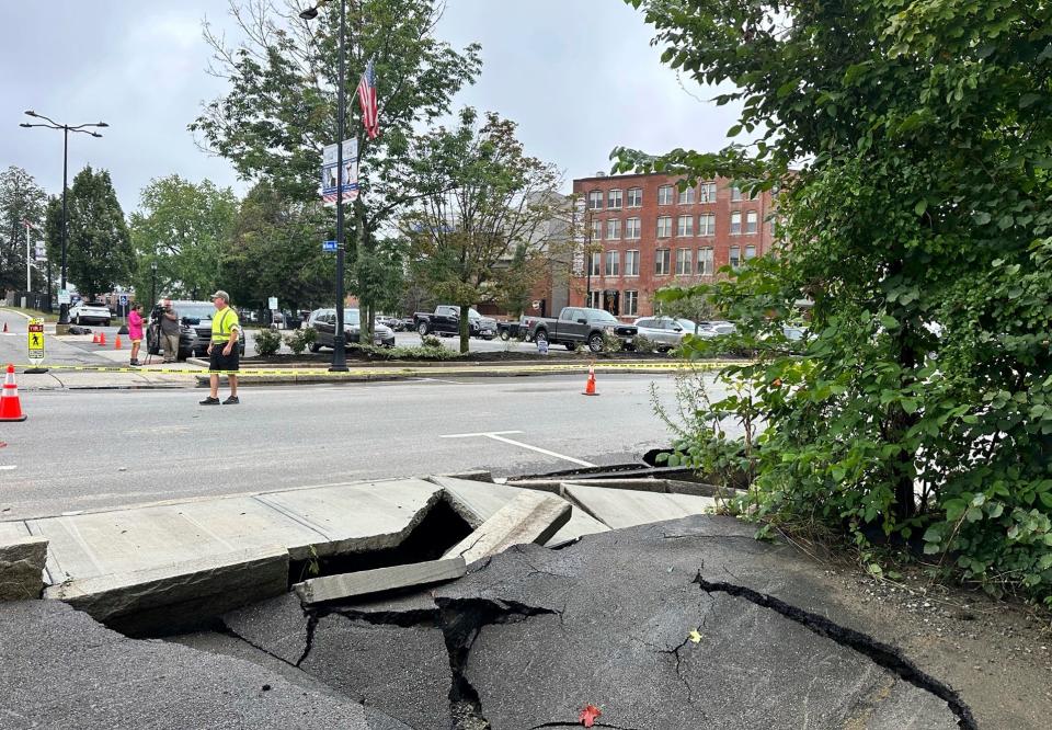 Roads and sidewalks are damaged following heavy rain in Leominster, Mass (Copyright 2023 The Associated Press. All rights reserved)