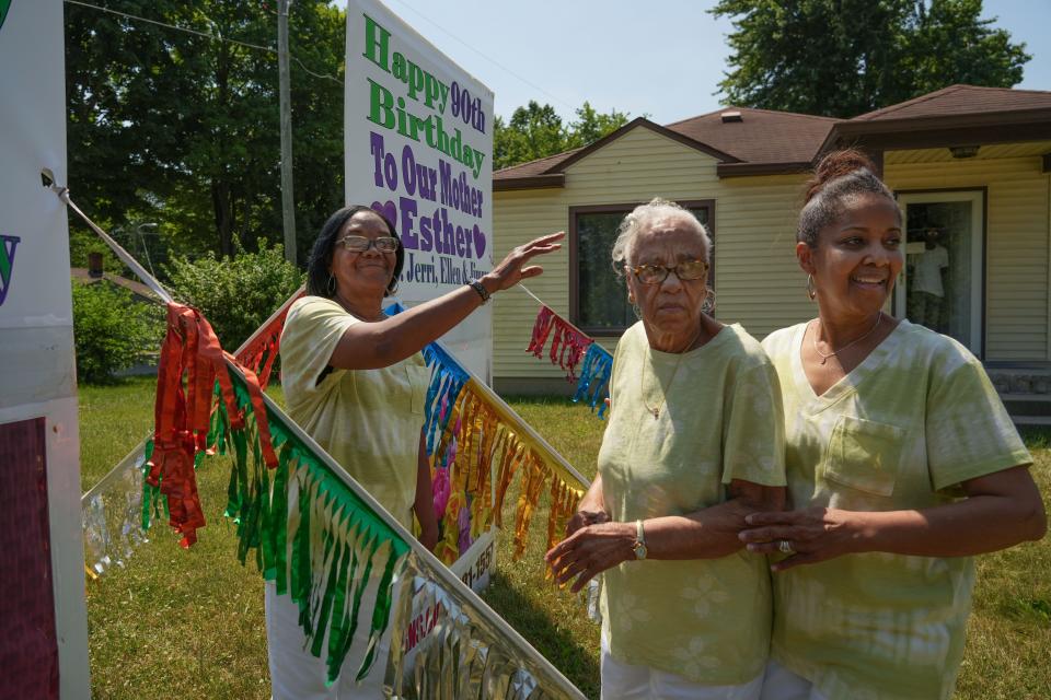 Ellen Cavanaugh, 63, right, and Jerri McReynolds, 65, left, walk their Mother Esther Williams outside for her 90th birthday celebration on Wednesday, June 22, 2022, in Indianapolis.  