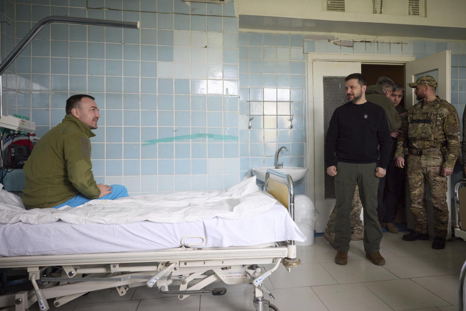 In this photo provided by the Ukrainian Presidential Press Office, Ukrainian President Volodymyr Zelenskyy visits a hospital near Avdiivka in Donetsk region, Ukraine, Tuesday, April 18, 2023. (Ukrainian Presidential Press Office via AP)