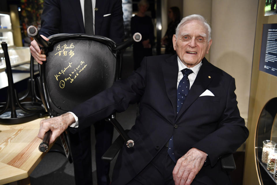 FILE - 2019 Nobel Laureate in chemistry John B. Goodenough looks on after signing a chair as part of the traditional Nobel Chair Signing ceremony at the Nobel Museum in Stockholm, Sweden, Friday Dec. 6, 2019. Goodenough, who shared the 2019 Nobel Prize in chemistry for his work helping develop the lithium-ion battery, transforming technology with rechargeable power for devices ranging from cellphones, computers, and pacemakers to electric cars, died Sunday, June 25, 2023,, the University of Texas announced Monday, June 26. He was 100. Goodenough was a faculty member at Texas for nearly 40 years. (Henrik Montgomery/TT via AP, File)