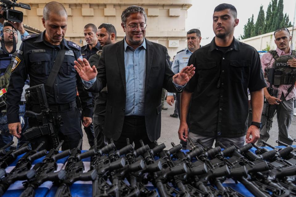 Israel's National Security Minister Itamar Ben-Gvir attends an event to deliver weapons to local volunteer security group members in Ashkelon, Israel, Friday, Oct. 27, 2023.