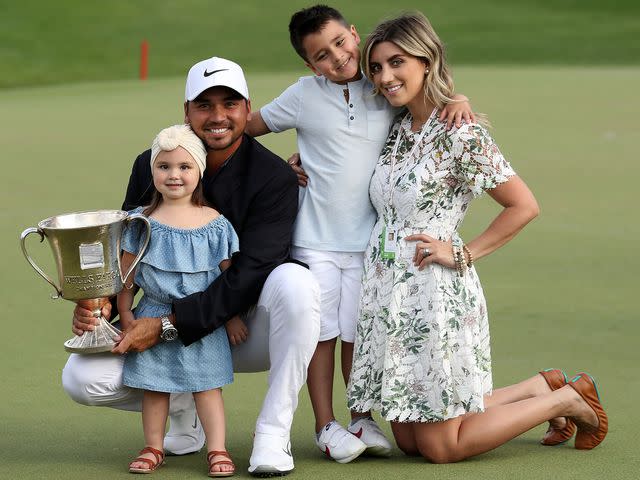 <p>Streeter Lecka/Getty</p> Jason Day and Ellie Day with their children, Dash and Lucy, on the 18th green after winning the 2018 Wells Fargo Championship on May 6, 2018 in Charlotte, North Carolina.