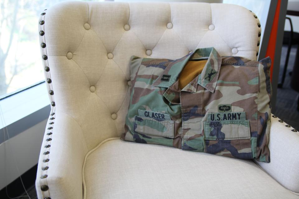 During his tenure as the brigade headquarters company commander in 2003, Brig. Gen. William Glaser’s mother was the unofficial seamstress for 2nd Brigade, 3rd Infantry Division. The company rolled into Iraq flying miniature guidons sewn by her, as was this pillowcase from an old battle dress uniform blouse seen sitting in his Orlando, Florida office on Feb. 23, 2023. (Staff/Davis Winkie)