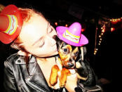 Celebrity photos: Miley Cyrus adopted this dog a week ago, and has been tweeting endless updates – including this cute photo of her and the dog wearing matching hats.