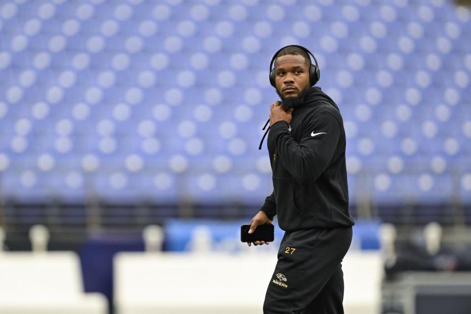 J.K. Dobbins looks on during pre-game warm-ups.