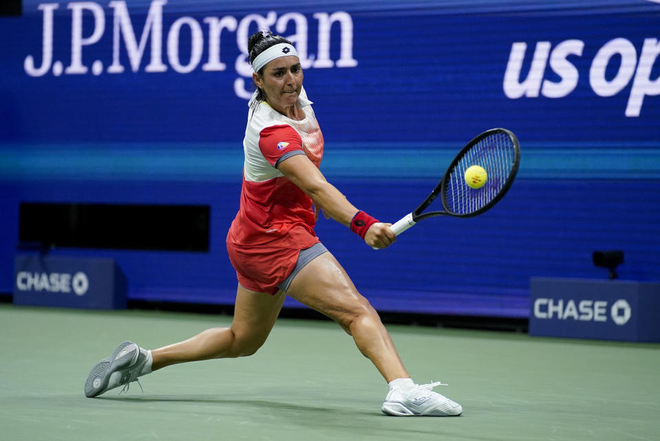 Ons Jabeur, of Tunisia, returns a shot to Ajla Tomljanovic, of Austrailia, during the quarterfinals of the U.S. Open tennis championships, Tuesday, Sept. 6, 2022, in New York. (AP Photo/Julia Nikhinson)