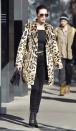 <p>Bella pairs her statement leopard coat with an all-black outfit: a tee, high-waisted jeans, Moschino belt, tinted sunglasses by Quay, Stuart Weitzman booties and a handbag, while out in NYC. </p>