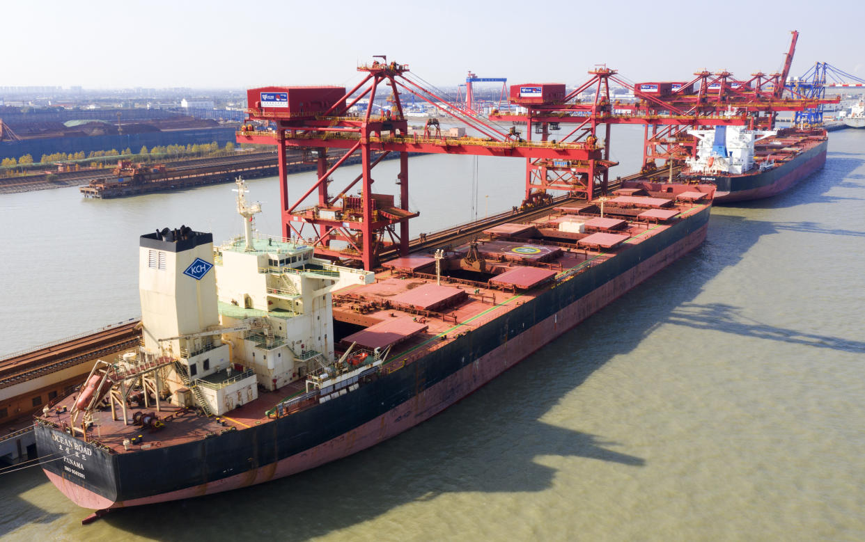 SUZHOU, CHINA - DECEMBER 9, 2020 - Aerial photo taken on December 9, 2020 shows a ship unloader unloading iron ore imported from Australia at an iron ore operation terminal in Taicang Port in Suzhou, East China's Jiangsu Province, China.- PHOTOGRAPH BY Costfoto / Barcroft Studios / Future Publishing (Photo credit should read Costfoto/Barcroft Media via Getty Images)