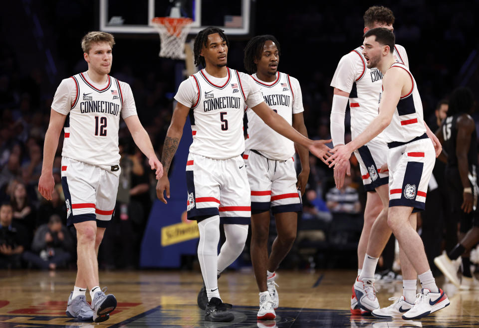 Cam Spencer (12), Stephon Castle (5), Alex Karaban (11) and the rest of the Connecticut Huskies are a popular pick to win the NCAA tournament. (Photo by Sarah Stier/Getty Images)