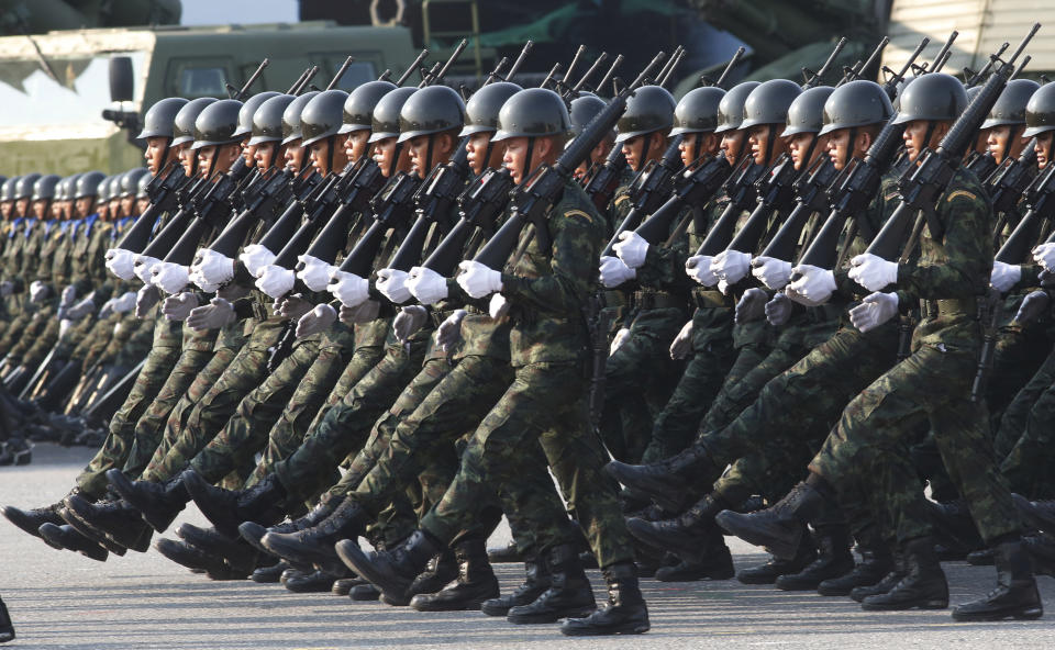 Thai soldiers parade during the Royal Thai Armed Forces Day ceremony at a military base in Bangkok, Thailand, Friday, Jan. 18, 2019. (AP Photo/Sakchai Lalit)