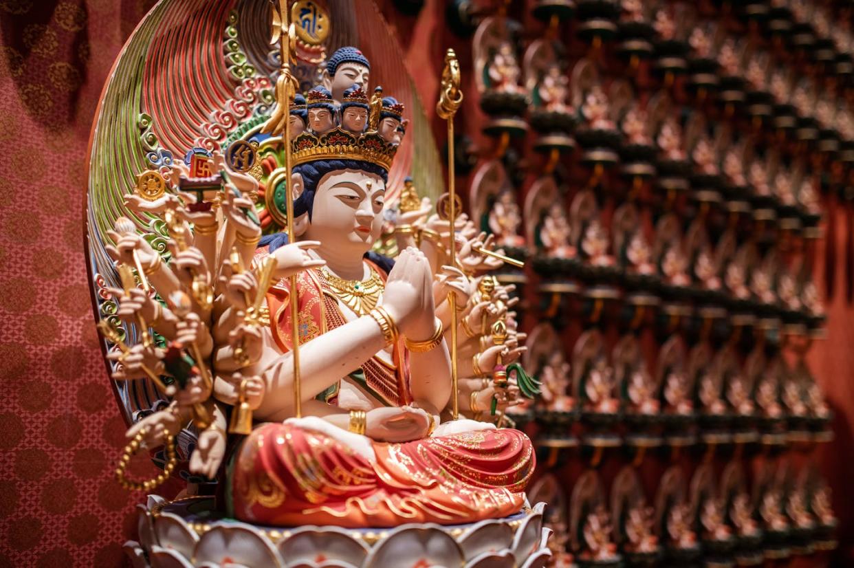 Boddhisatva Avalokiteśvara, considered to be a compassionate protector, is believed to regularly visit Earth. <a href="https://www.gettyimages.com/detail/photo/bust-of-god-avalokiteshvara-singapore-royalty-free-image/1200705559?phrase=Avalokiteshvara&adppopup=true" rel="nofollow noopener" target="_blank" data-ylk="slk:taikrixel/ via iStock Getty Images Plus;elm:context_link;itc:0;sec:content-canvas" class="link ">taikrixel/ via iStock Getty Images Plus</a>