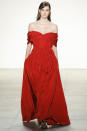 <p>A striking red off the shoulder dress at Brock Collection. (Photo: Getty Images) </p>