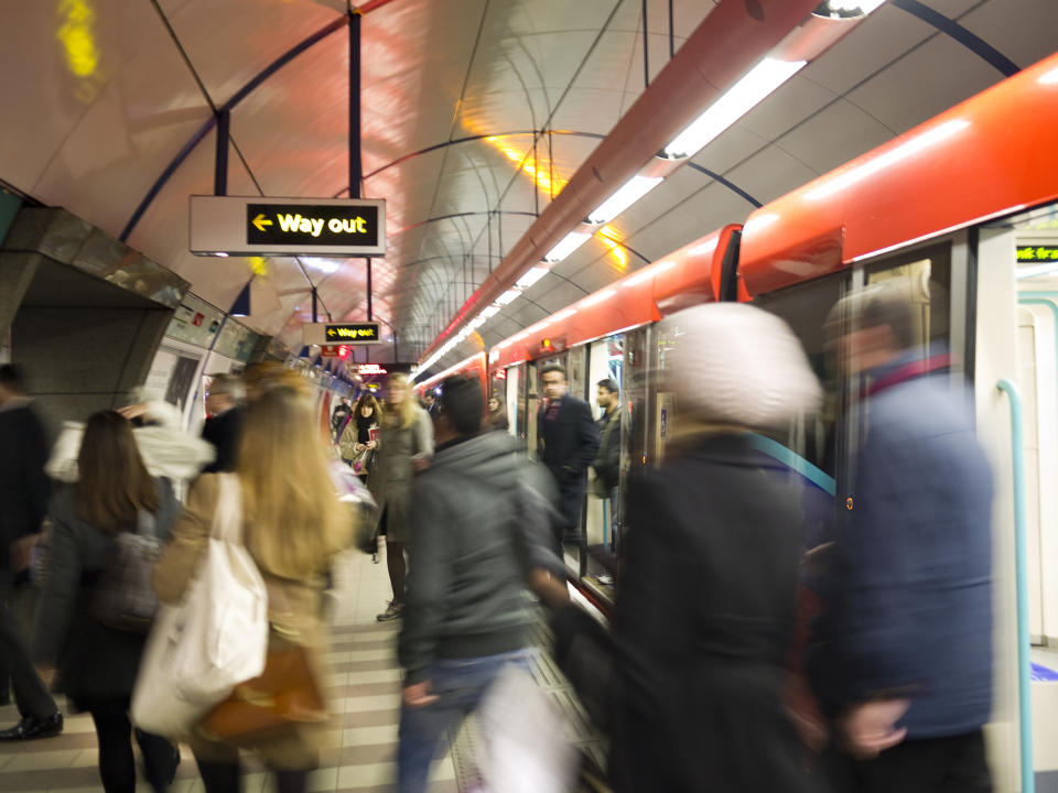 Blurring people in a London tube station.