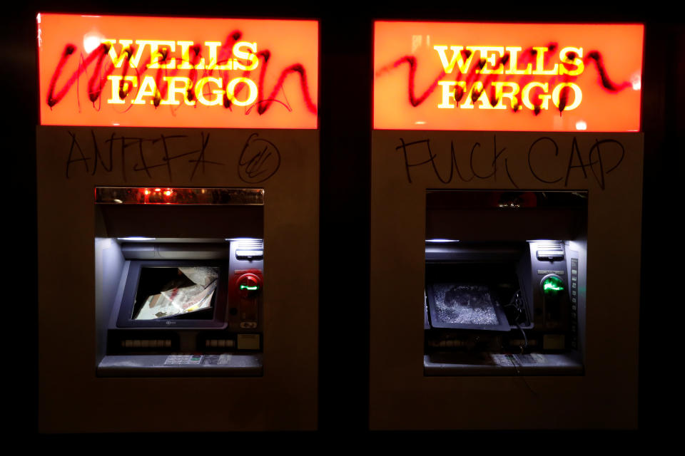 Vandalized ATMs are seen at a Wells Fargo bank after a student protest turned violent at UC Berkeley during a demonstration over right-wing speaker Milo Yiannopoulos, who was forced to cancel his talk, in Berkeley, California on February 1, 2017.&nbsp;