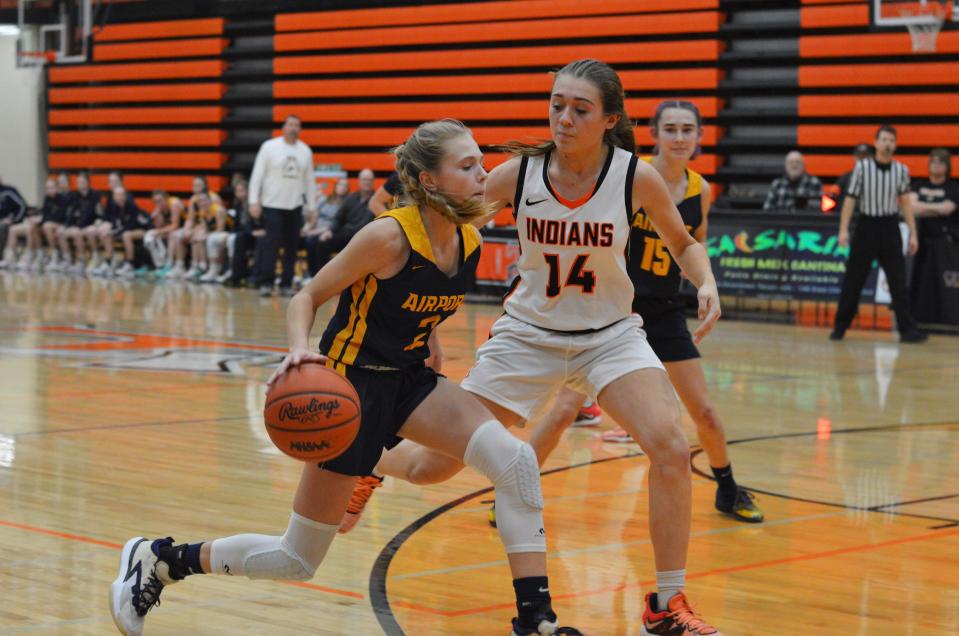 Olvia Gratz of Airport is guarded by Tecumseh's Natalie Bullinger Tuesday night.