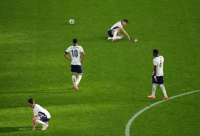 England players look downcast after their draw with Denmark