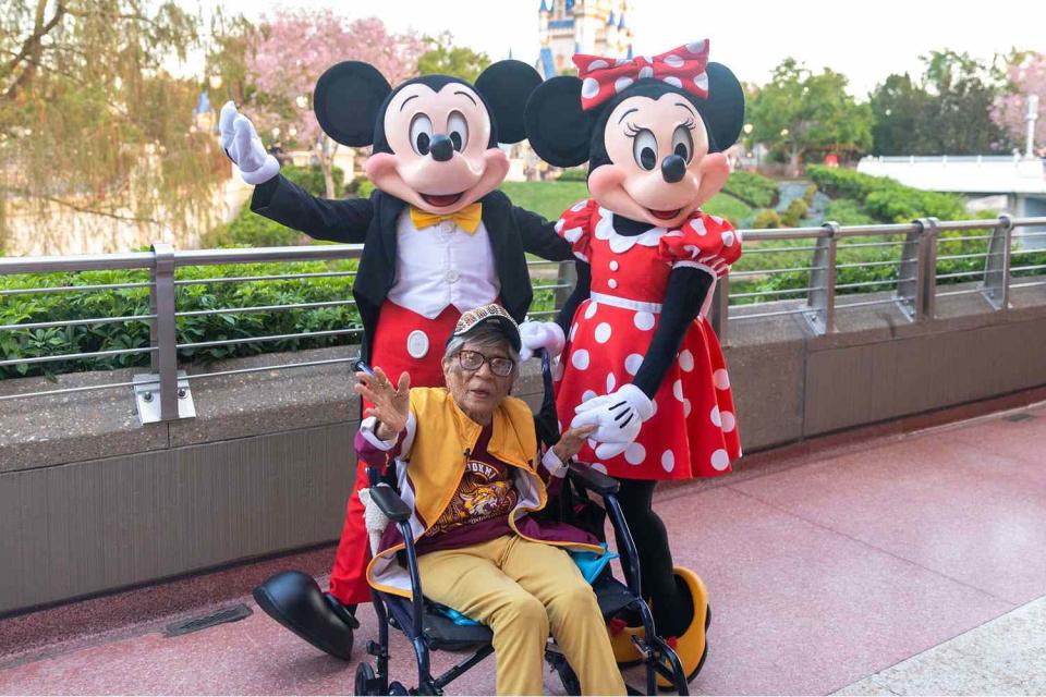 <p>Bennett Stoops/Walt Disney World</p> Magnolia Jackson with Mickey and Minnie Mouse in the Magic Kingdom