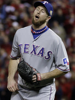 Rangers reliever Scott Feldman reacts after Lance Berkman's single with two strikes and two outs in the 10th inning tied Game 6