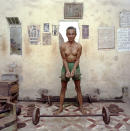 <p>Weightlifter, 1987. (© William E. Crawford from the book “Hanoi Streets 1985-2015: In the Years of Forgetting”) </p>