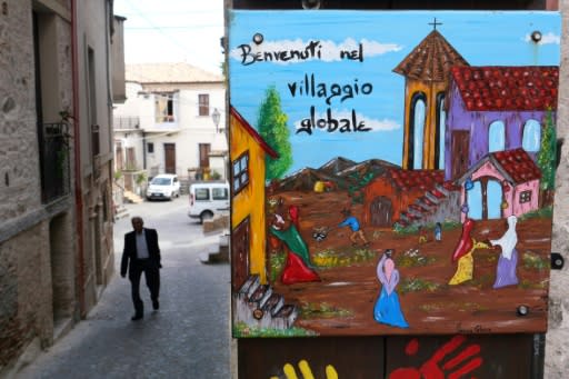 The colourful welcoming signs for refugees are still up, but the town of Riace has swung far-right, against the migrant experiment it once championed